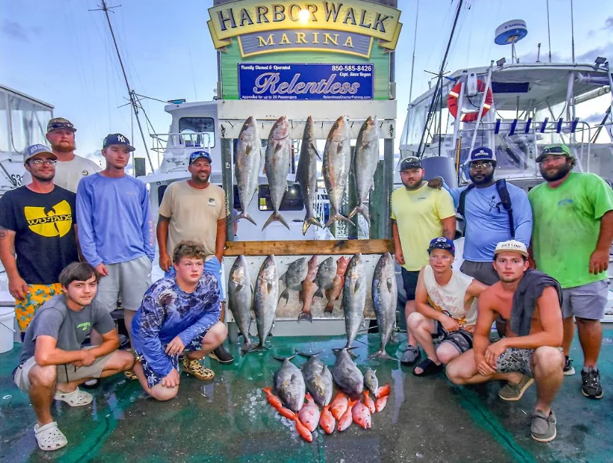 Fencing materials and tools displayed in a professional shop setting, showcasing chain link, wood, vinyl, and aluminum fence components ready for installation.